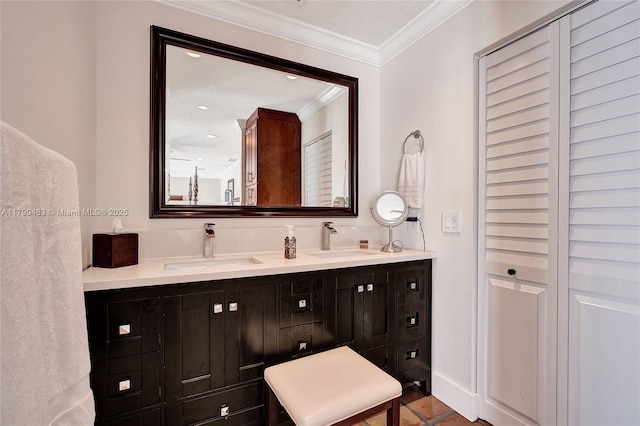 bathroom featuring double vanity, recessed lighting, ornamental molding, and a sink