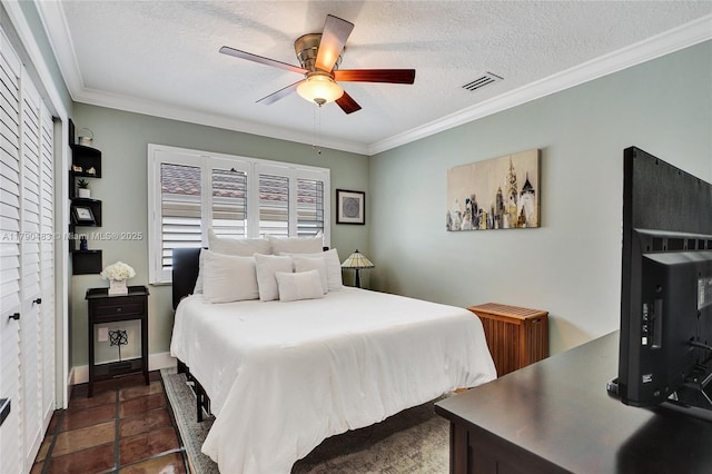 bedroom with a textured ceiling, visible vents, crown molding, and radiator