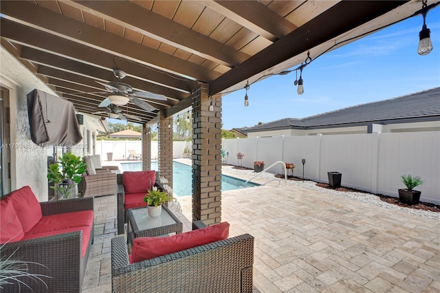 view of patio / terrace with a fenced in pool, an outdoor living space, ceiling fan, and a fenced backyard