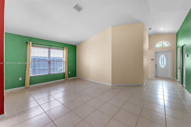 entryway with baseboards, visible vents, a healthy amount of sunlight, and light tile patterned flooring
