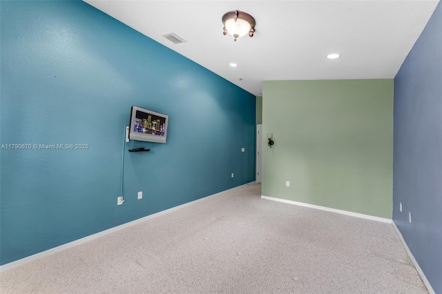 unfurnished room with visible vents, recessed lighting, carpet flooring, and baseboards