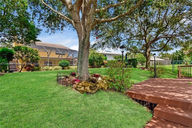 14950 Featherstone Way, Davie, FL 33331 - view of yard with a wooden deck and glass enclosure
