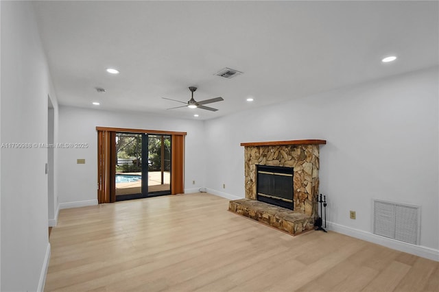 unfurnished living room featuring baseboards, ceiling fan, light wood-type flooring, and visible vents
