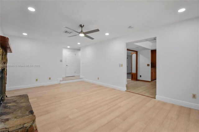 14950 Featherstone Way, Davie, FL 33331 - unfurnished living room with ceiling fan, recessed lighting, light wood finished floors, a fireplace with raised hearth, and baseboards