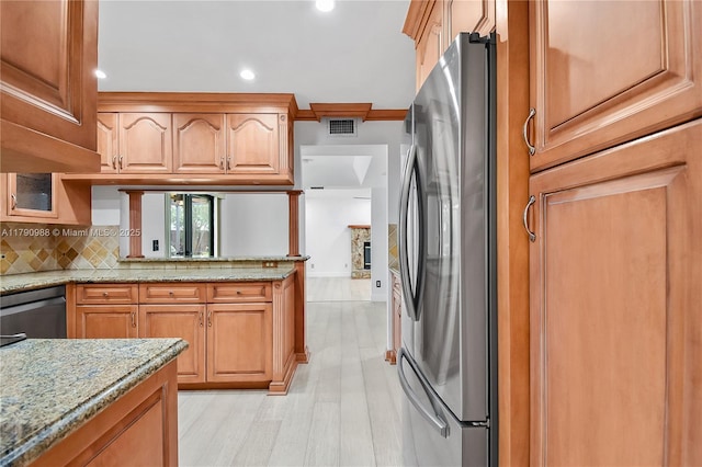 kitchen featuring visible vents, appliances with stainless steel finishes, tasteful backsplash, light stone countertops, and recessed lighting