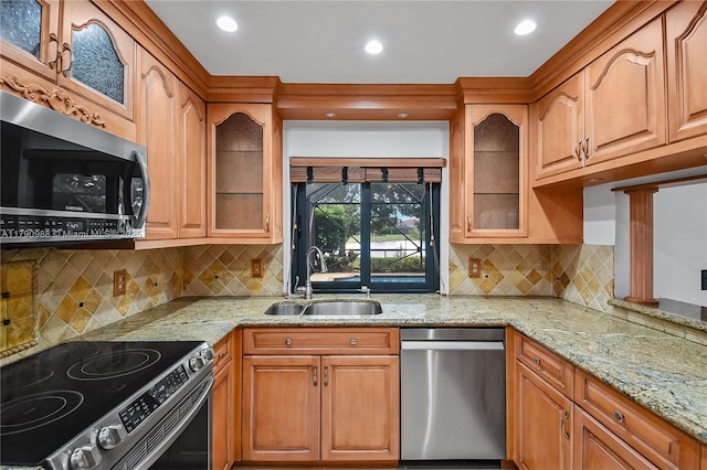 14950 Featherstone Way, Davie, FL 33331 - kitchen with appliances with stainless steel finishes, a sink, light stone countertops, and recessed lighting
