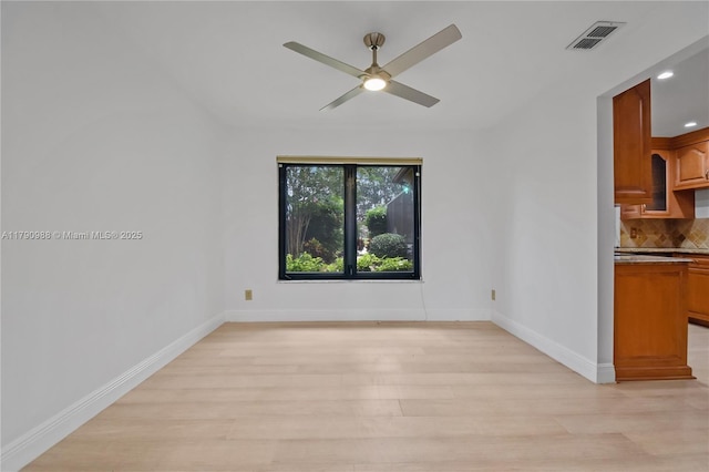 unfurnished room featuring light wood-style floors, baseboards, ceiling fan, and recessed lighting