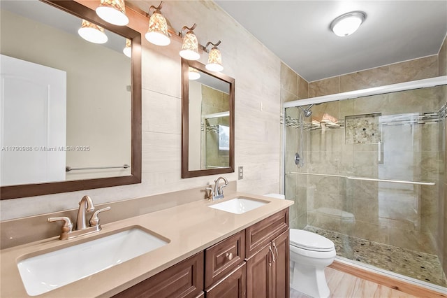 14950 Featherstone Way, Davie, FL 33331 - full bathroom with a stall shower, toilet, and double vanity