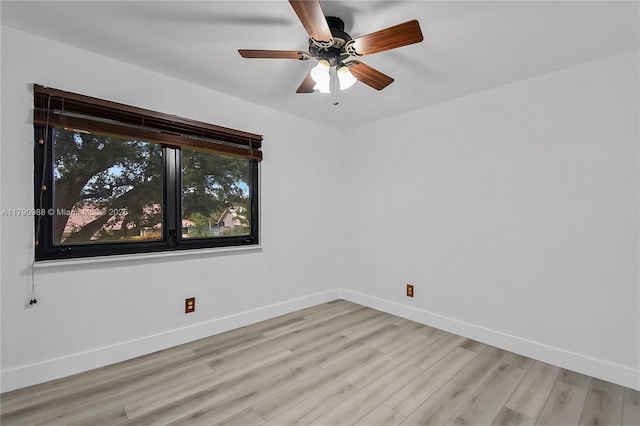 14950 Featherstone Way, Davie, FL 33331 - spare room featuring light wood-style flooring, baseboards, and a ceiling fan