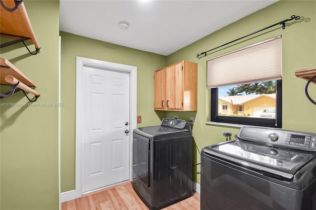 14950 Featherstone Way, Davie, FL 33331 - clothes washing area with separate washer and dryer, cabinet space, light wood-style flooring, and baseboards