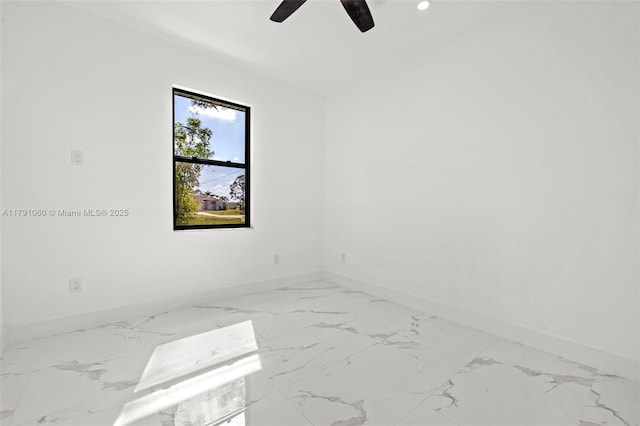 empty room with baseboards, recessed lighting, ceiling fan, and marble finish floor