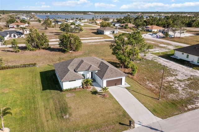 aerial view featuring a water view and a residential view