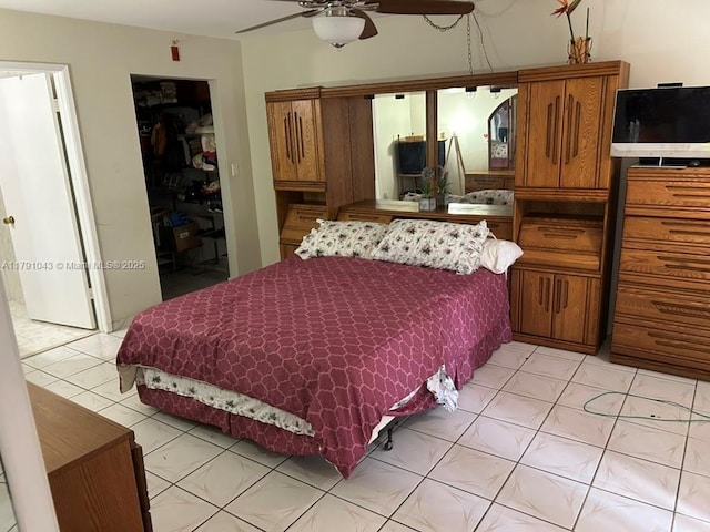 9040 SW 125th Ave Unit D105, Miami, FL 33186 - bedroom featuring a walk in closet, light tile patterned flooring, and a closet