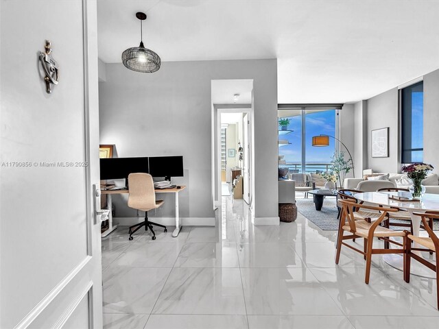 888 Brickell Key Dr Unit 2709, Miami, FL 33131 - office space featuring baseboards, a wall of windows, and marble finish floor