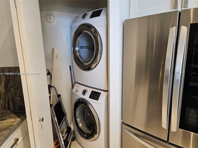 laundry area with stacked washing maching and dryer and laundry area