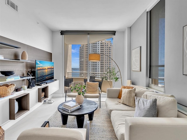 888 Brickell Key Dr Unit 2709, Miami, FL 33131 - living room with visible vents and floor to ceiling windows