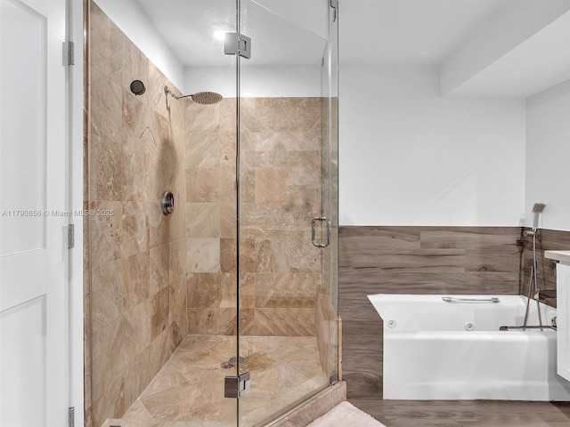 888 Brickell Key Dr Unit 2709, Miami, FL 33131 - full bath with tile walls, a whirlpool tub, and a shower stall