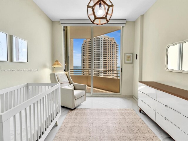 888 Brickell Key Dr Unit 2709, Miami, FL 33131 - bedroom featuring access to outside and floor to ceiling windows