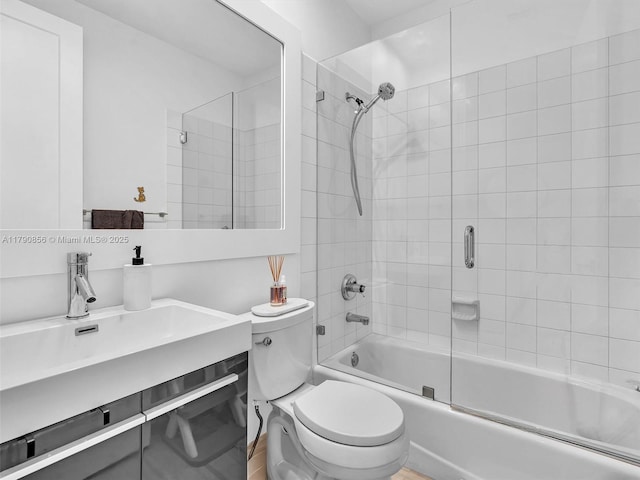 888 Brickell Key Dr Unit 2709, Miami, FL 33131 - bathroom featuring toilet, enclosed tub / shower combo, and a sink