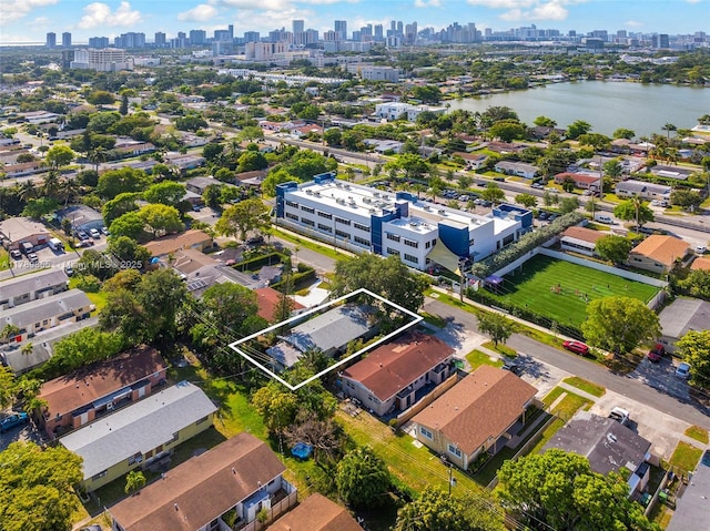 bird's eye view featuring a water view and a city view