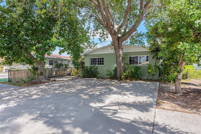 view of front of home featuring fence