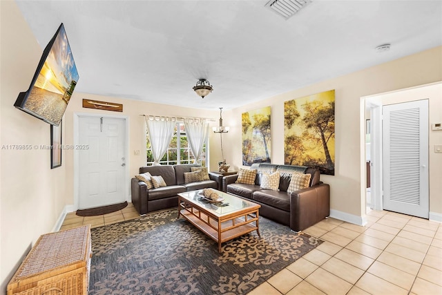 living room featuring visible vents, baseboards, and light tile patterned floors