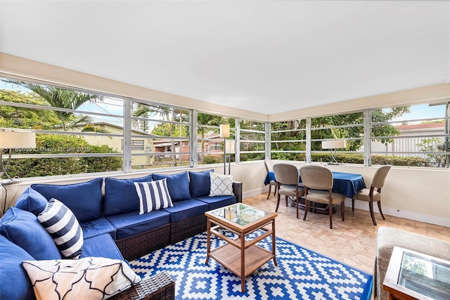 sunroom featuring an outdoor living space