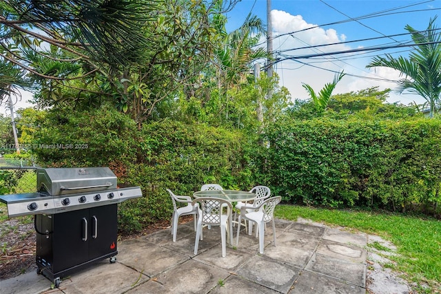 view of patio / terrace with outdoor dining area and a grill