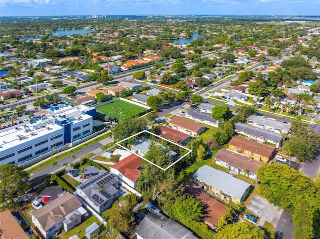 birds eye view of property featuring a residential view and a water view