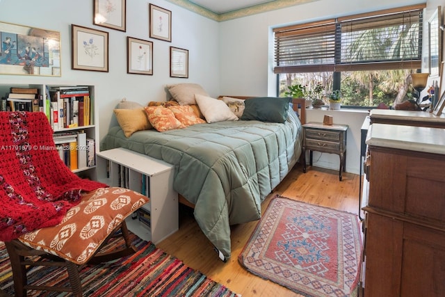 bedroom featuring wood finished floors