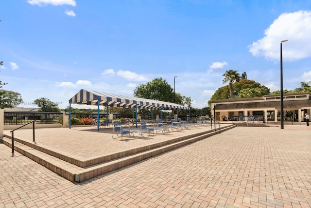 view of property's community featuring fence