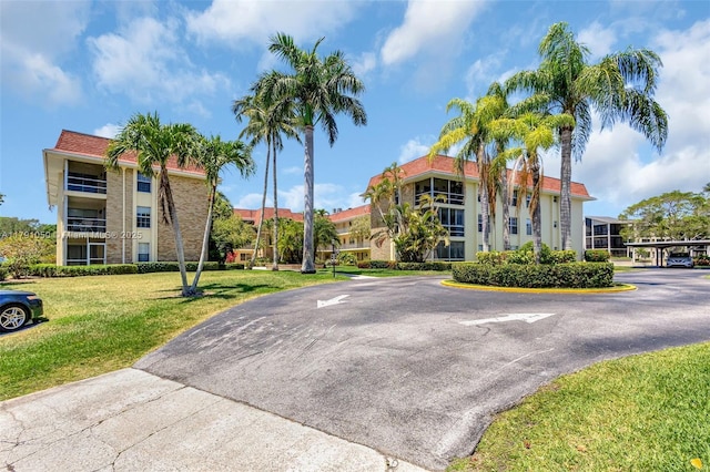 view of property with uncovered parking