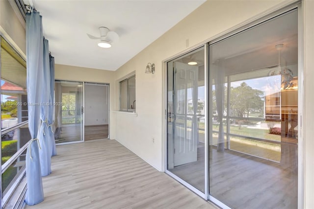 exterior space with ceiling fan