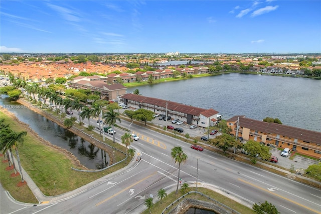 aerial view of residential area with a large body of water