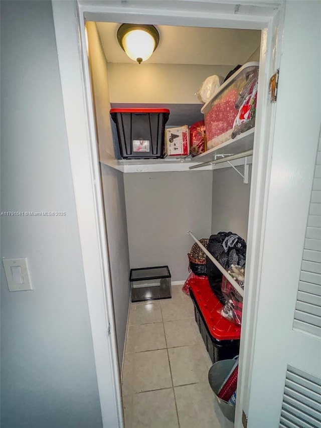 800 NE 195th St Unit 518, Miami, FL 33179 - walk in closet featuring tile patterned floors
