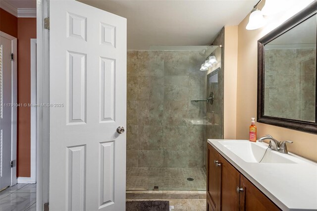 800 NE 195th St Unit 518, Miami, FL 33179 - full bathroom featuring a tile shower, ornamental molding, and vanity