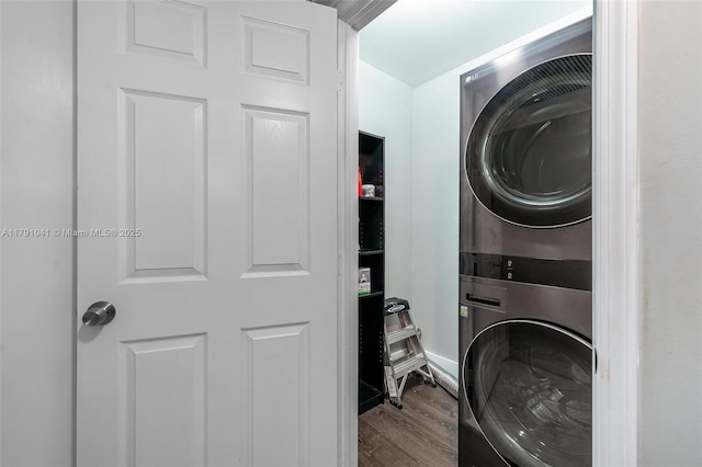 800 NE 195th St Unit 518, Miami, FL 33179 - clothes washing area featuring laundry area, stacked washer and clothes dryer, and wood finished floors