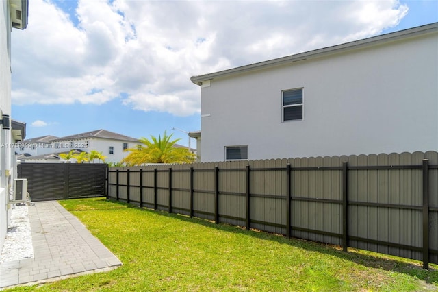 view of yard with a patio and a fenced backyard
