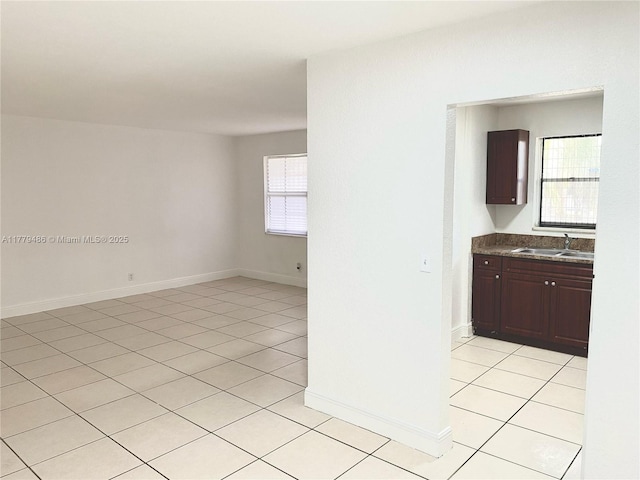 4160 NW 21st St Unit 216-E, Lauderhill, FL 33313 - empty room with a sink and light tile patterned floors