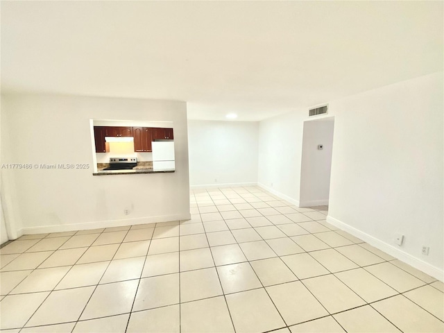 4160 NW 21st St Unit 216-E, Lauderhill, FL 33313 - unfurnished room featuring visible vents, baseboards, and light tile patterned floors