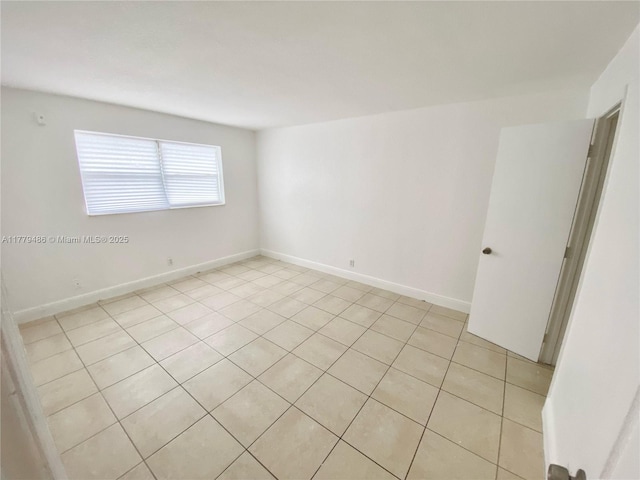 4160 NW 21st St Unit 216-E, Lauderhill, FL 33313 - unfurnished room with baseboards and light tile patterned floors