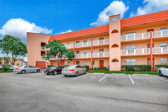 9281 Sunrise Lakes Blvd Unit 306, Sunrise, FL 33322 - view of apartment building / complex featuring uncovered parking