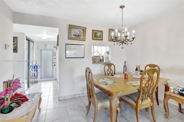 9281 Sunrise Lakes Blvd Unit 306, Sunrise, FL 33322 - dining area featuring a chandelier, light tile patterned flooring, and baseboards