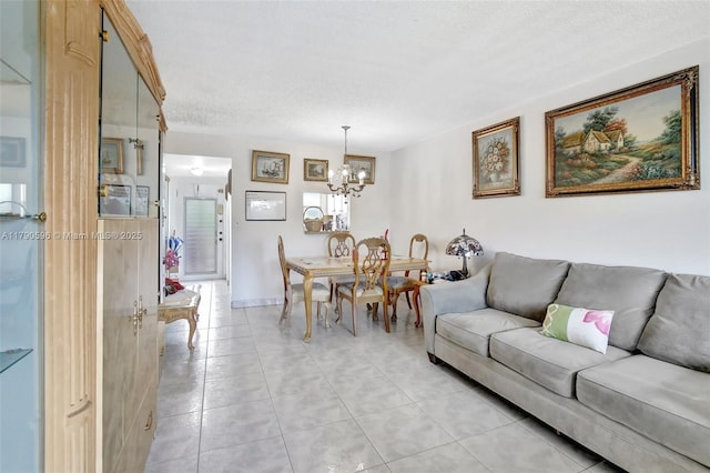 9281 Sunrise Lakes Blvd Unit 306, Sunrise, FL 33322 - living area featuring a chandelier, light tile patterned floors, and a textured ceiling