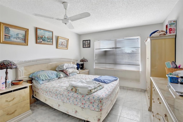 9281 Sunrise Lakes Blvd Unit 306, Sunrise, FL 33322 - bedroom featuring a textured ceiling, light tile patterned flooring, and ceiling fan