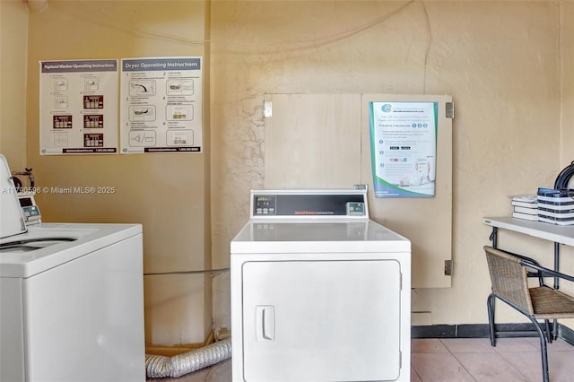 9281 Sunrise Lakes Blvd Unit 306, Sunrise, FL 33322 - community laundry featuring tile patterned flooring and washer and clothes dryer