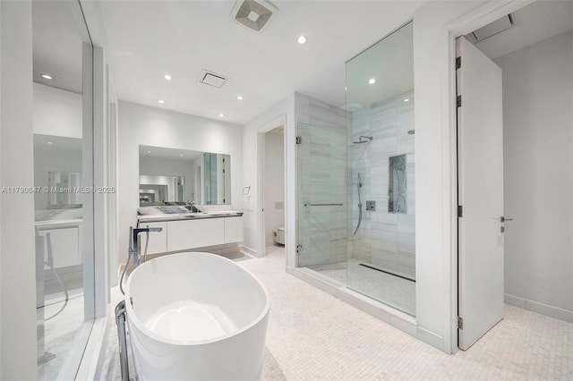 700 NE 26th Ter Unit Th-403, Miami, FL 33137 - bathroom with a stall shower, a soaking tub, recessed lighting, and vanity