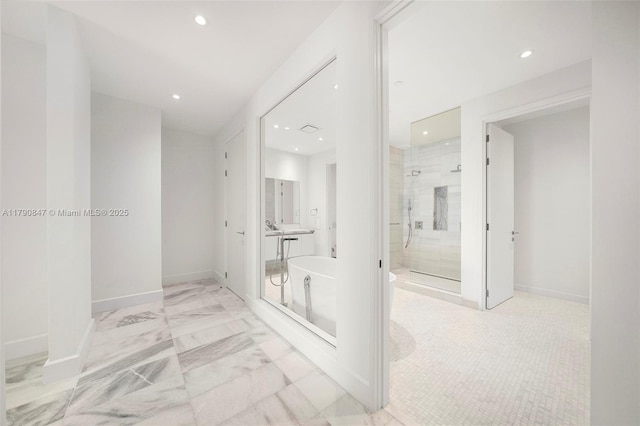 hall featuring recessed lighting, marble finish floor, and baseboards