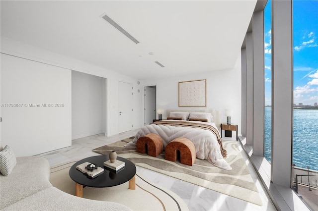 700 NE 26th Ter Unit Th-403, Miami, FL 33137 - bedroom featuring a water view and light marble finish flooring