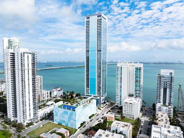 drone / aerial view with a view of city and a water view